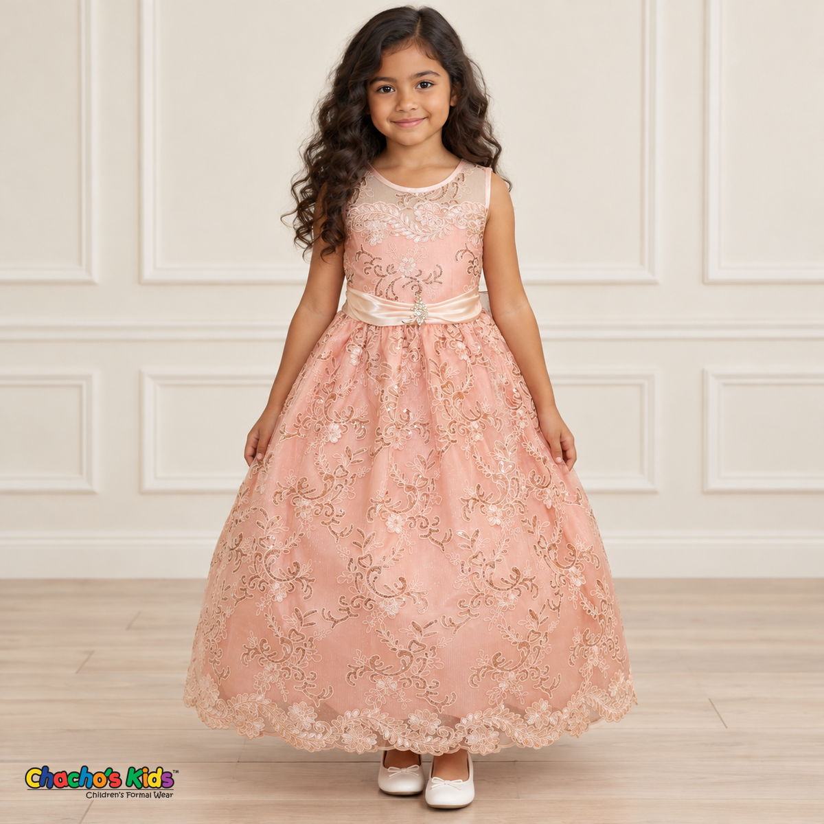 Girl wearing the Blush Floral Embroidered Dress, Style D1550, front view, showing floral embroidery, a sheer neckline and a decorated satin sash.