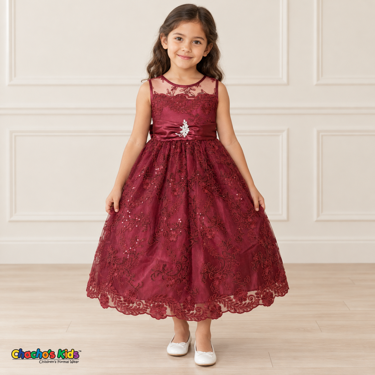 Girl wearing the Burgundy Floral Embroidered Dress, Style D1550, front view, showing floral embroidery, a sheer neckline and a decorated satin sash.