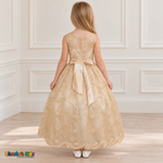 Girl wearing the Champagne Floral Embroidered Dress, Style D1550, back view, showing the embroidered sheer back, zipper and satin bow.
