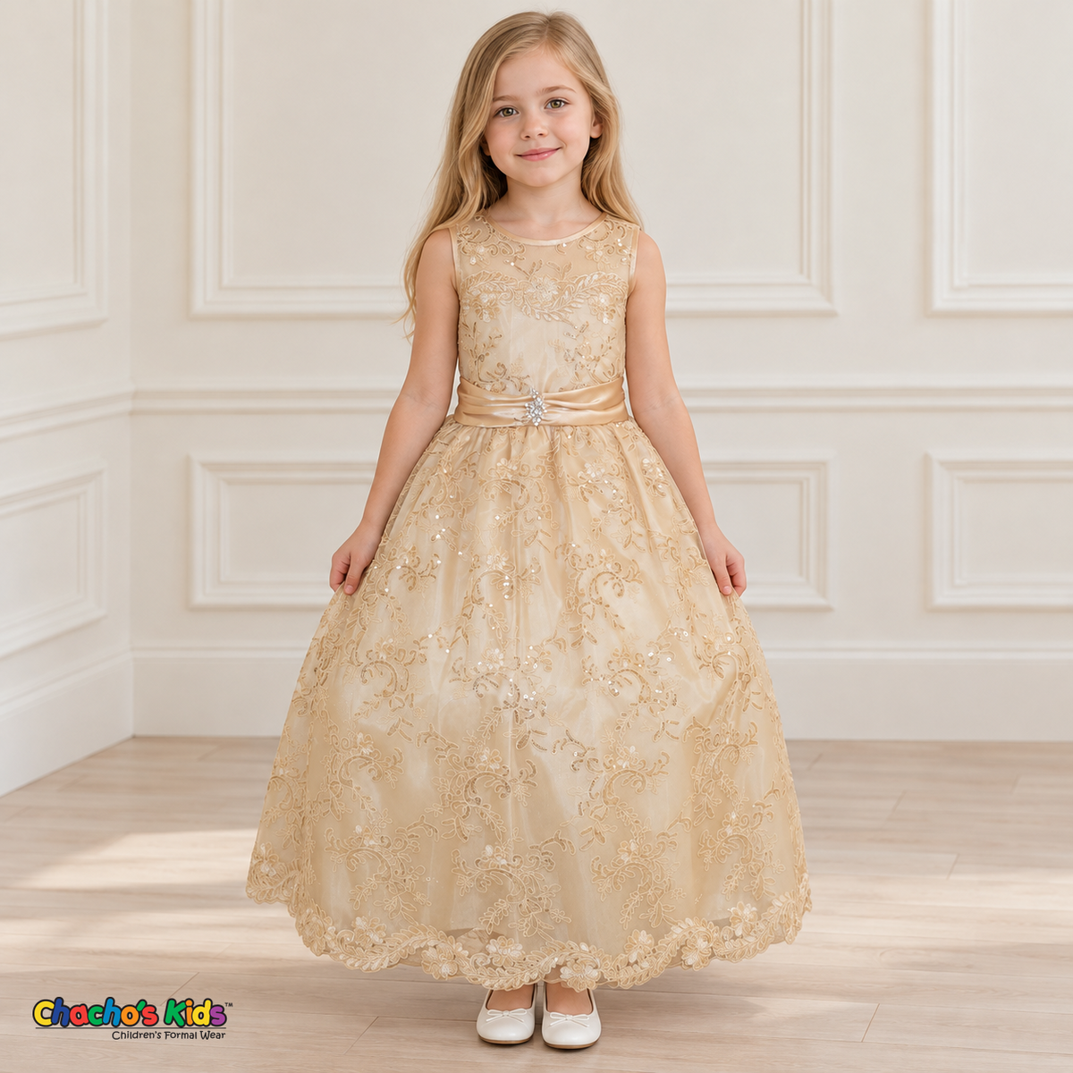 Girl wearing the Champagne Floral Embroidered Dress, Style D1550, front view, showing floral embroidery, a sheer neckline and a decorated satin sash.