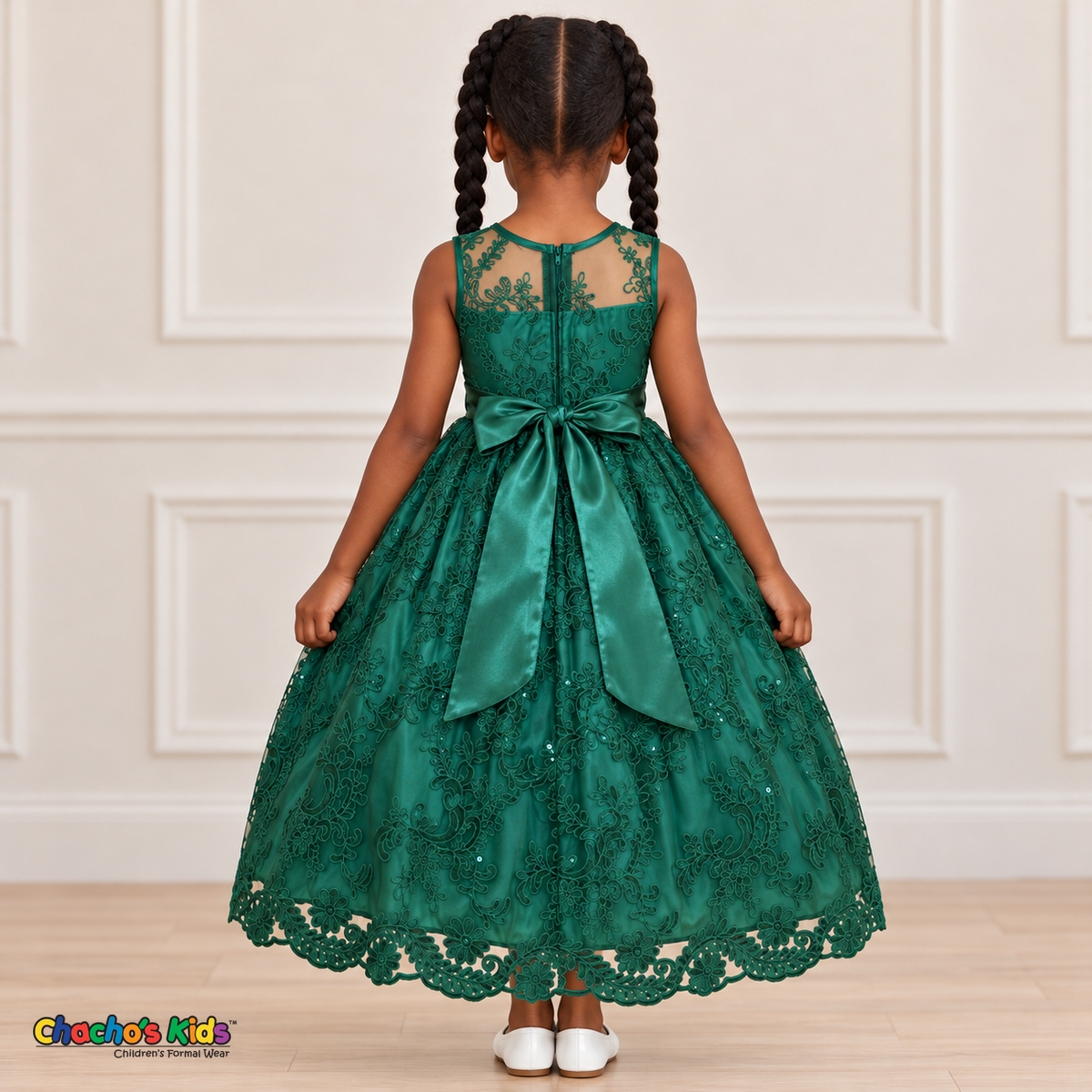 Girl wearing the Hunter Green Floral Embroidered Dress, Style D1550, back view, showing the embroidered sheer back, zipper and satin bow.