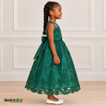 Girl wearing the Hunter Green Floral Embroidered Dress, Style D1550, side view, showing the sleeveless silhouette, floral embroidery and scalloped skirt.