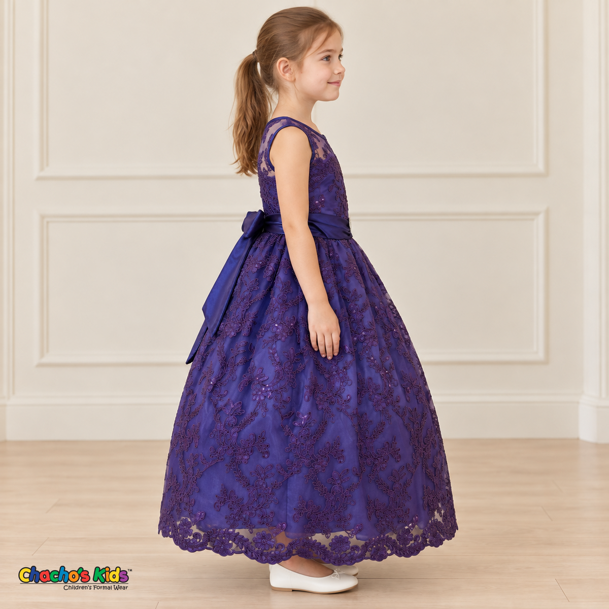 Girl wearing the Purple Floral Embroidered Dress, Style D1550, side view, showing the sleeveless silhouette, floral embroidery and scalloped skirt.
