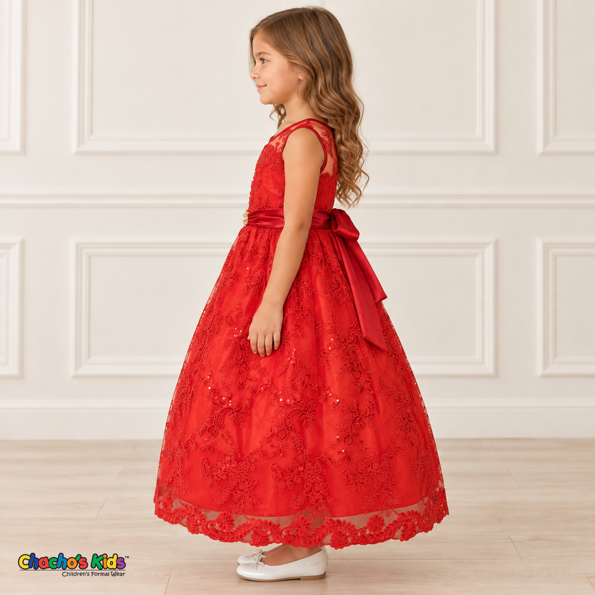 Girl wearing the Red Floral Embroidered Dress, Style D1550, side view, showing the sleeveless silhouette, floral embroidery and scalloped skirt.
