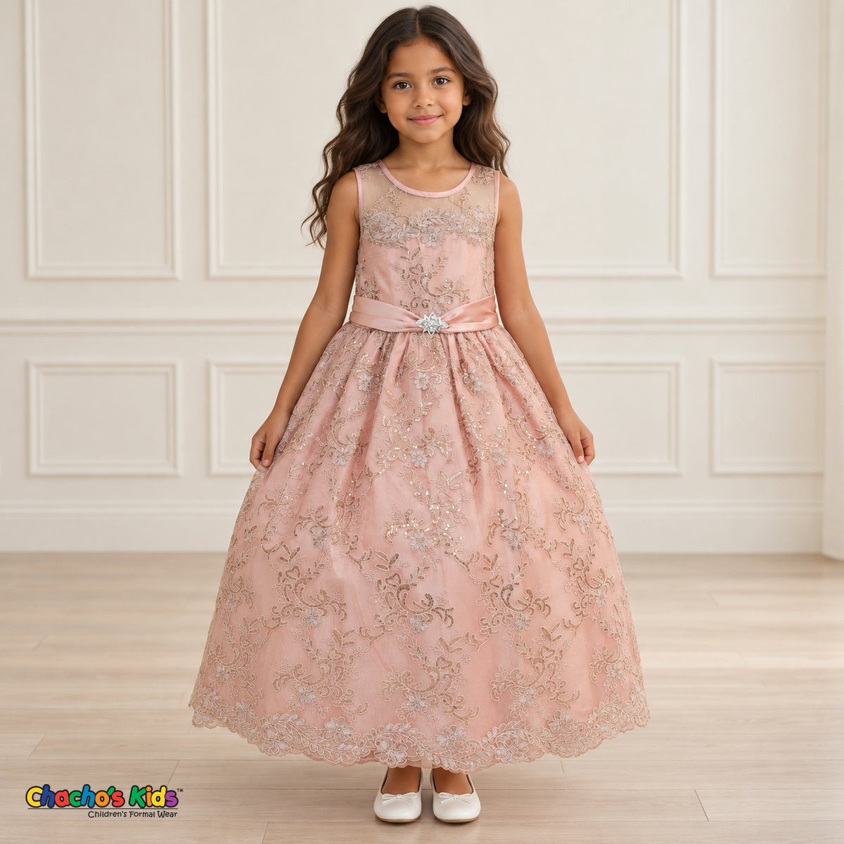 Girl wearing the Rose Gold Floral Embroidered Dress, Style D1550, front view, showing floral embroidery, a sheer neckline and a decorated satin sash.