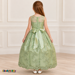 Girl wearing the Sage Green Floral Embroidered Dress, Style D1550, back view, showing the embroidered sheer back, zipper and satin bow.