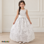 Girl wearing the White Floral Embroidered Dress, Style D1550, front view, showing floral embroidery, sequins and a rosette waist accent.