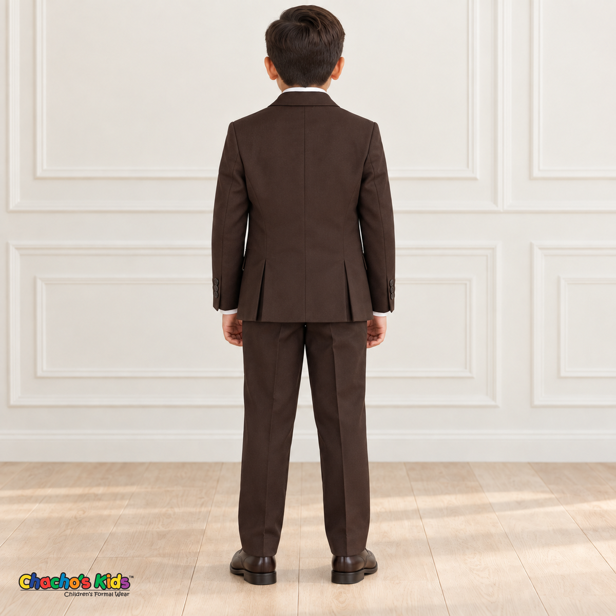 Back view of a boy wearing the brown executive Italian-cut suit, showing the coat's double back vents.
