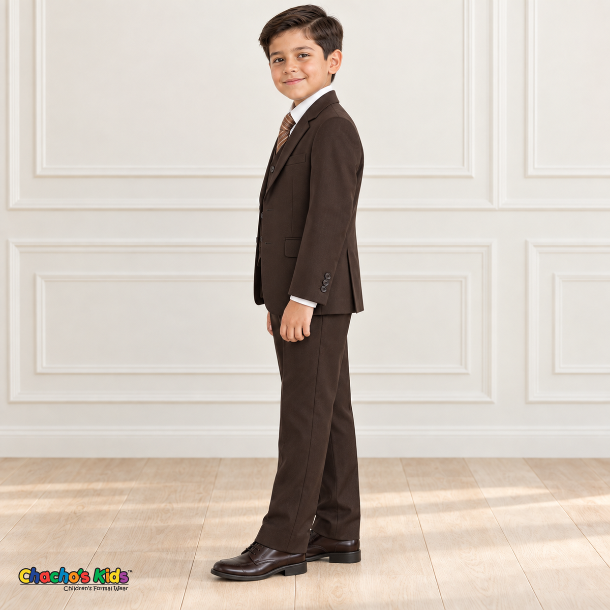 Side view of a boy wearing the brown executive Italian-cut five-piece suit.