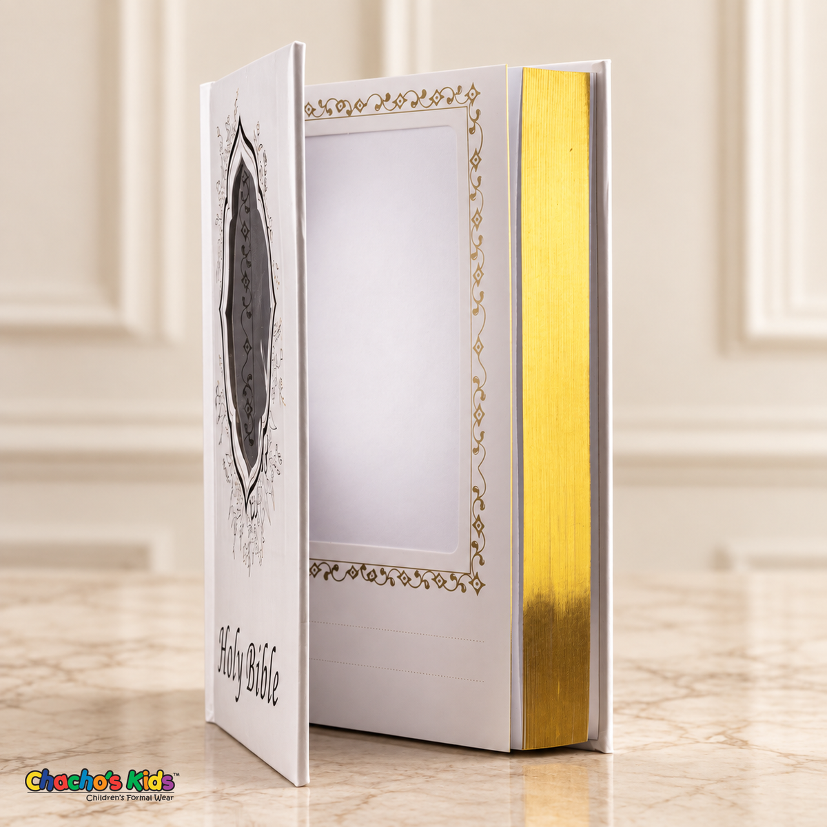 Large English Holy Bible with white cover and gold details — open view showing the interior photo pocket and reflective page edges