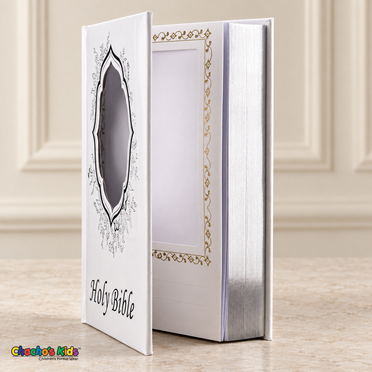 Large English Holy Bible with white hardcover and silver floral details, open to show the interior photo pocket and silver page edges
