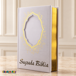 Large Spanish Holy Bible with white cover and gold details — front view with blank portrait window and reflective page edges