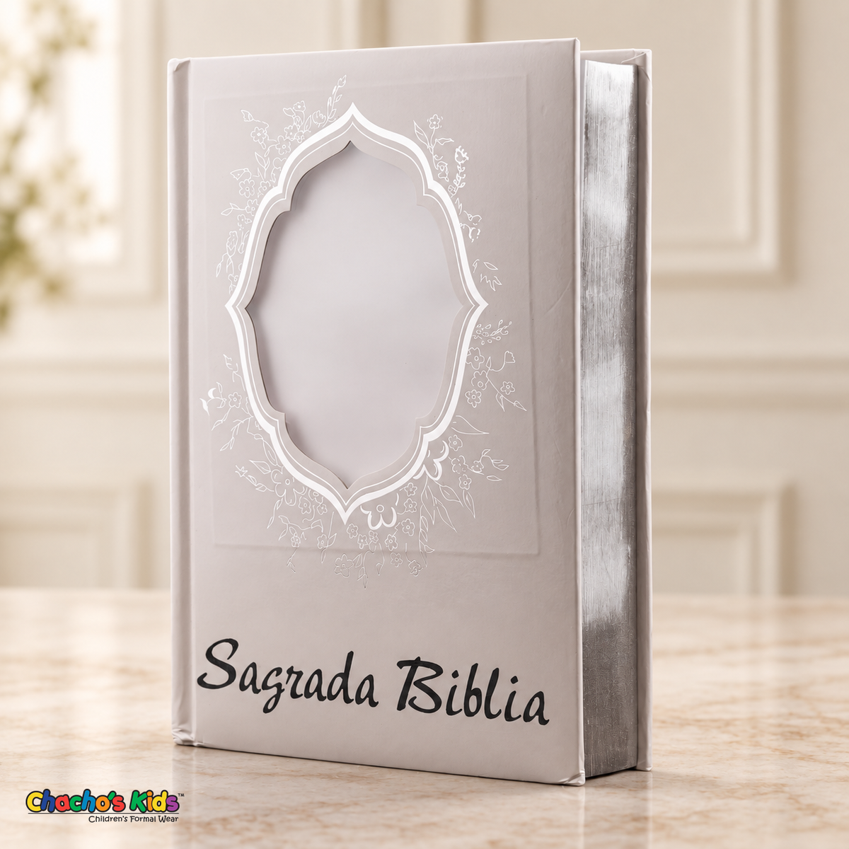 Large Spanish Holy Bible with white cover and silver details — front view with blank portrait window and reflective page edges