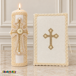 Lit ivory baptism candle with champagne cord cross and matching Bible with a sparkling gold-tone cross.