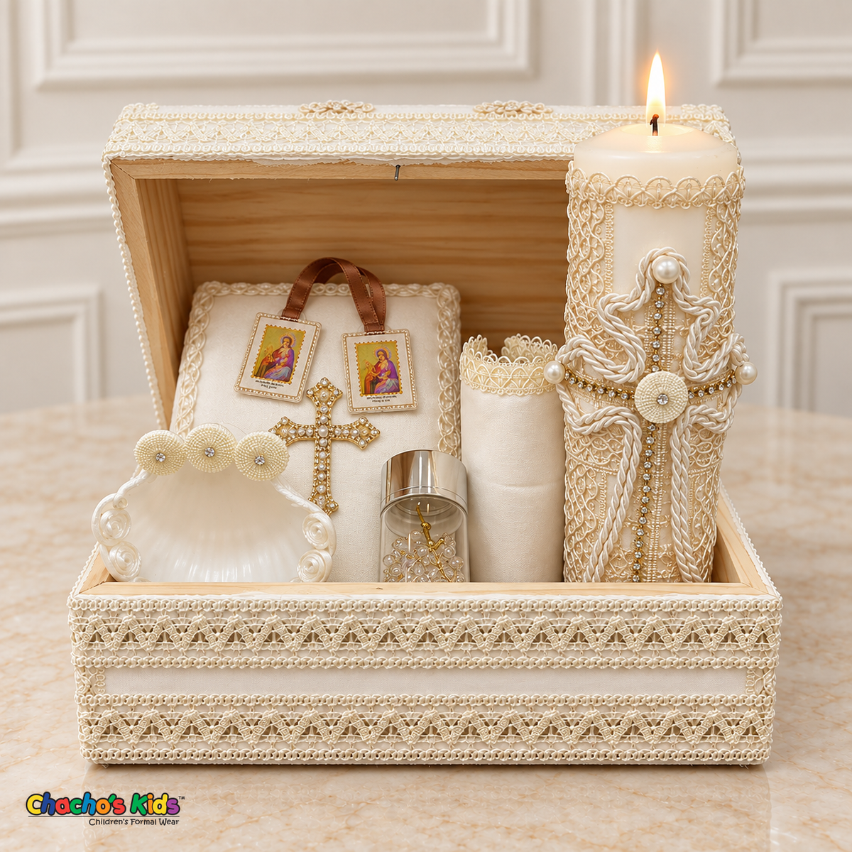 Open ivory wooden keepsake chest holding the boys baptism candle, cross Bible, shell, gold-tone rosary in a jar, scapular, and handkerchief.