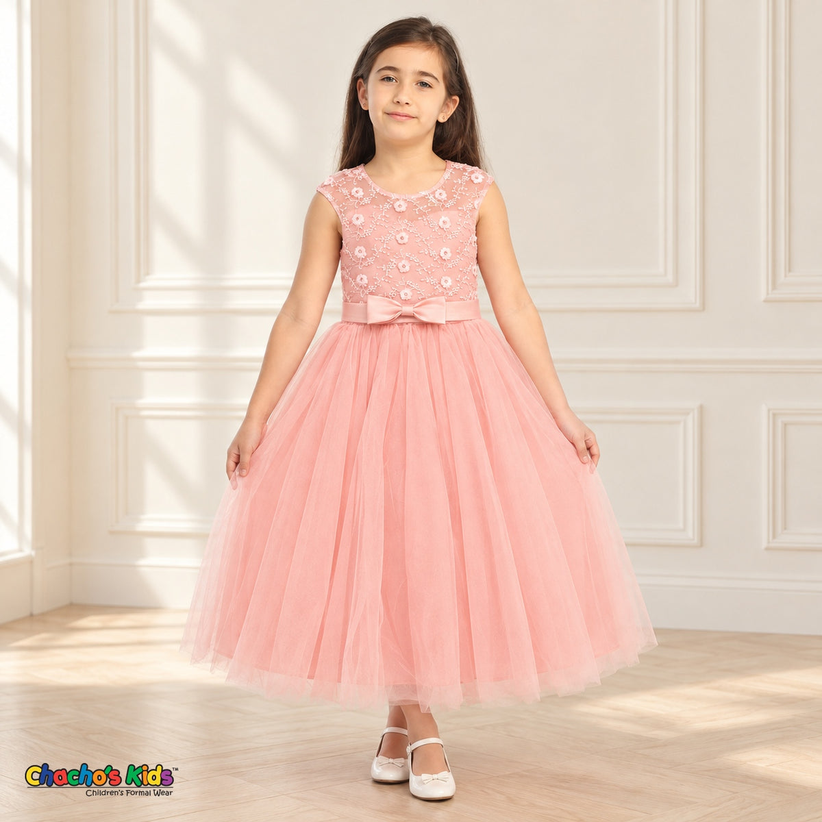 Blush KE07 floral embroidered tulle dress on a child model, front view showing the floral organza bodice, satin waist bow and tea-length skirt.