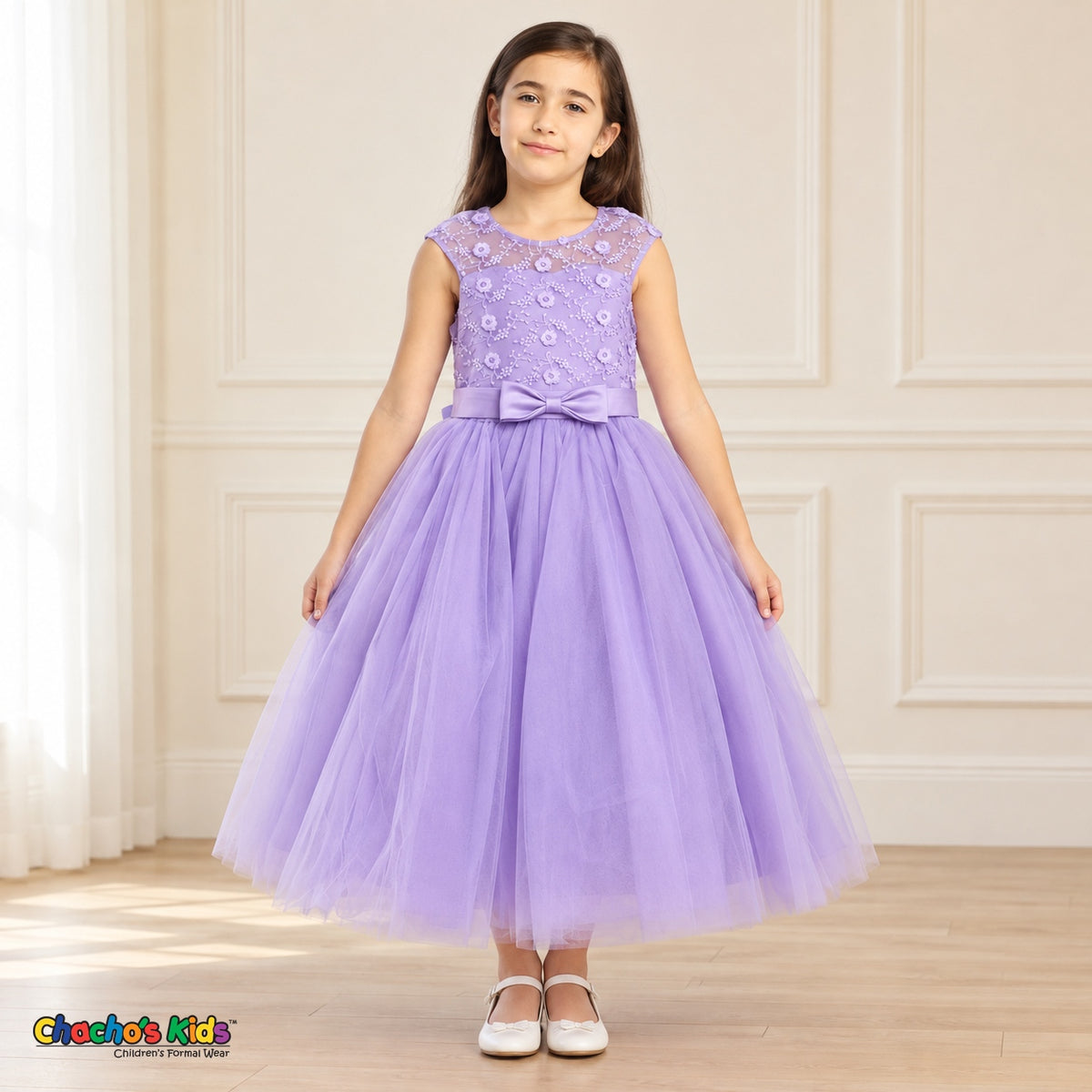 Lilac KE07 floral embroidered tulle dress on a child model, front view showing the sheer floral bodice, satin bow and tea-length skirt.