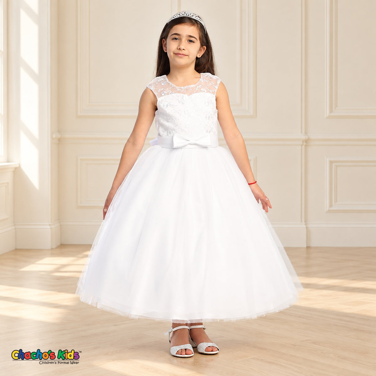 White KE07 floral embroidered tulle dress on a child model, front view showing the sheer neckline, satin bow and full tea-length skirt.