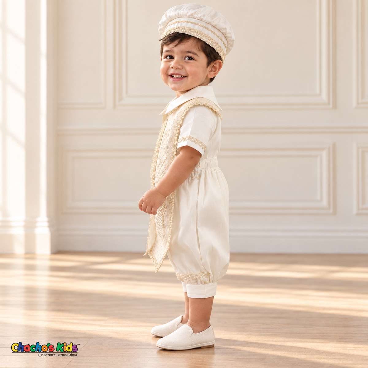 Ivory Otto boys baptism four-piece outfit, ivory left side showing the matching hat, shirt, romper and embroidered stole.