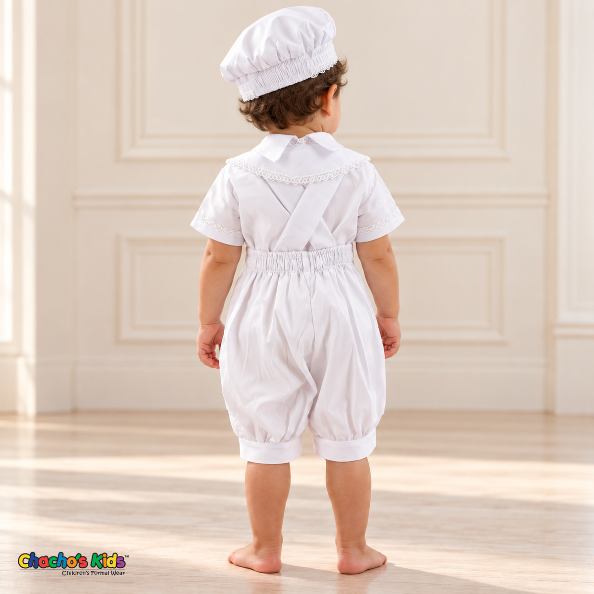 White Otto boys baptism four-piece outfit, white back showing the matching hat, shirt, romper and embroidered stole.