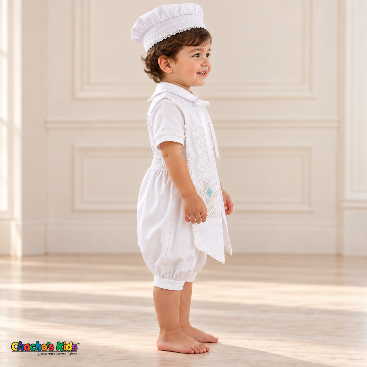 White Otto boys baptism four-piece outfit, white right side showing the matching hat, shirt, romper and embroidered stole.