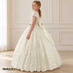 Side view of the ivory Victorian Heirloom Embroidered Dress R130, showing adjustable side lacing, floral embroidery and the long layered skirt.