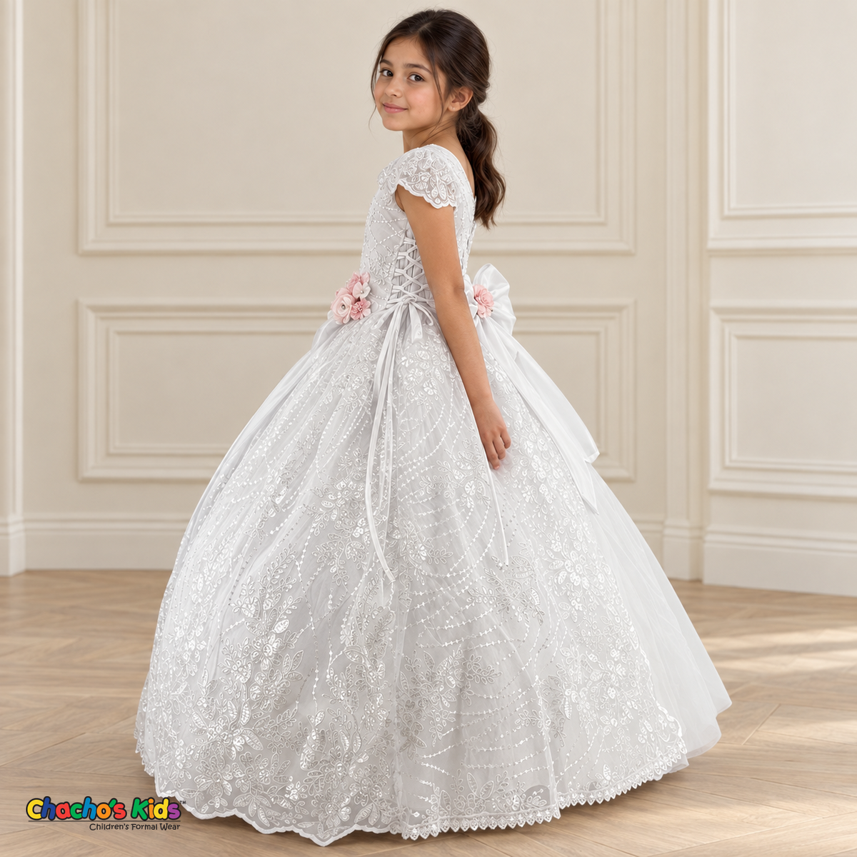 Side view of the white Victorian Heirloom Embroidered Dress R130, showing adjustable side lacing, floral embroidery and the long layered skirt.