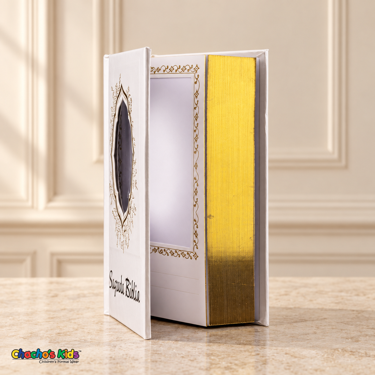 Small Spanish Holy Bible with white hardcover and gold-tone details, open to show the interior photo pocket and reflective page edges