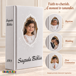 Small Spanish Holy Bible with white hardcover and silver-tone details, with sample baptism, wedding, and First Communion portraits