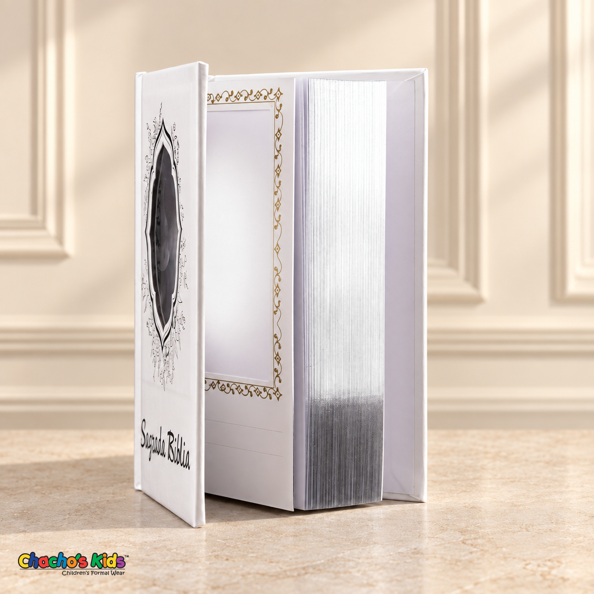 Small Spanish Holy Bible with white hardcover and silver-tone details, open to show the interior photo pocket and reflective page edges