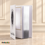 Small Spanish Holy Bible with white hardcover and silver-tone details, open to show the interior photo pocket and reflective page edges
