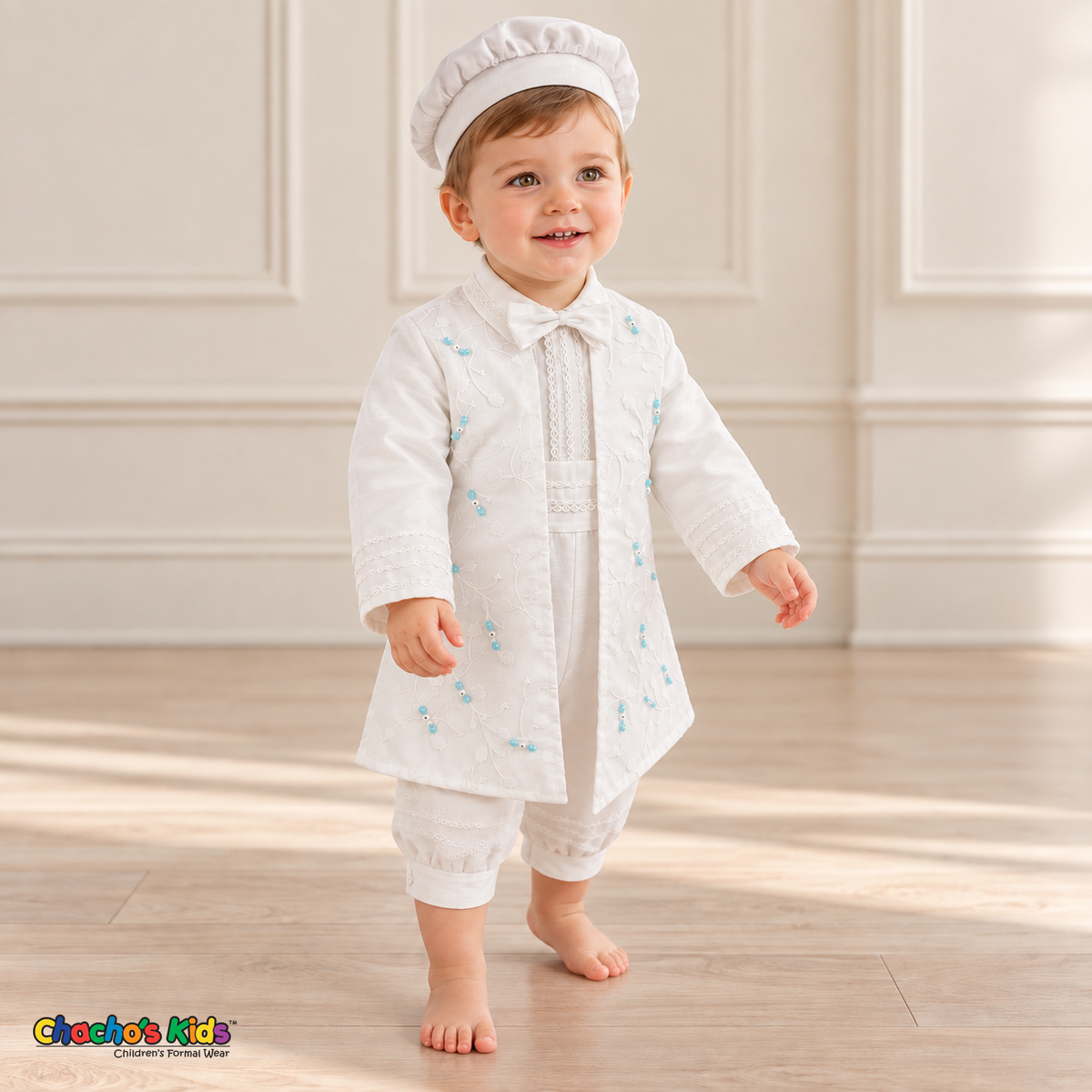 Tony white five-piece boys baptism outfit, three quarter front with embroidered coat and lace trim