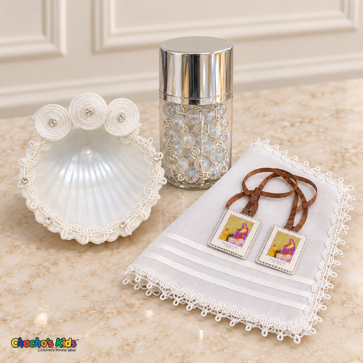White three-rosette baptism shell, striped white handkerchief, brown-ribbon scapular and iridescent rosary in a silver-lidded jar.