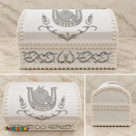 Three views of the white and silver horse baptism chest showing the embroidered front, horse-and-horseshoe lid and plain trimmed side.