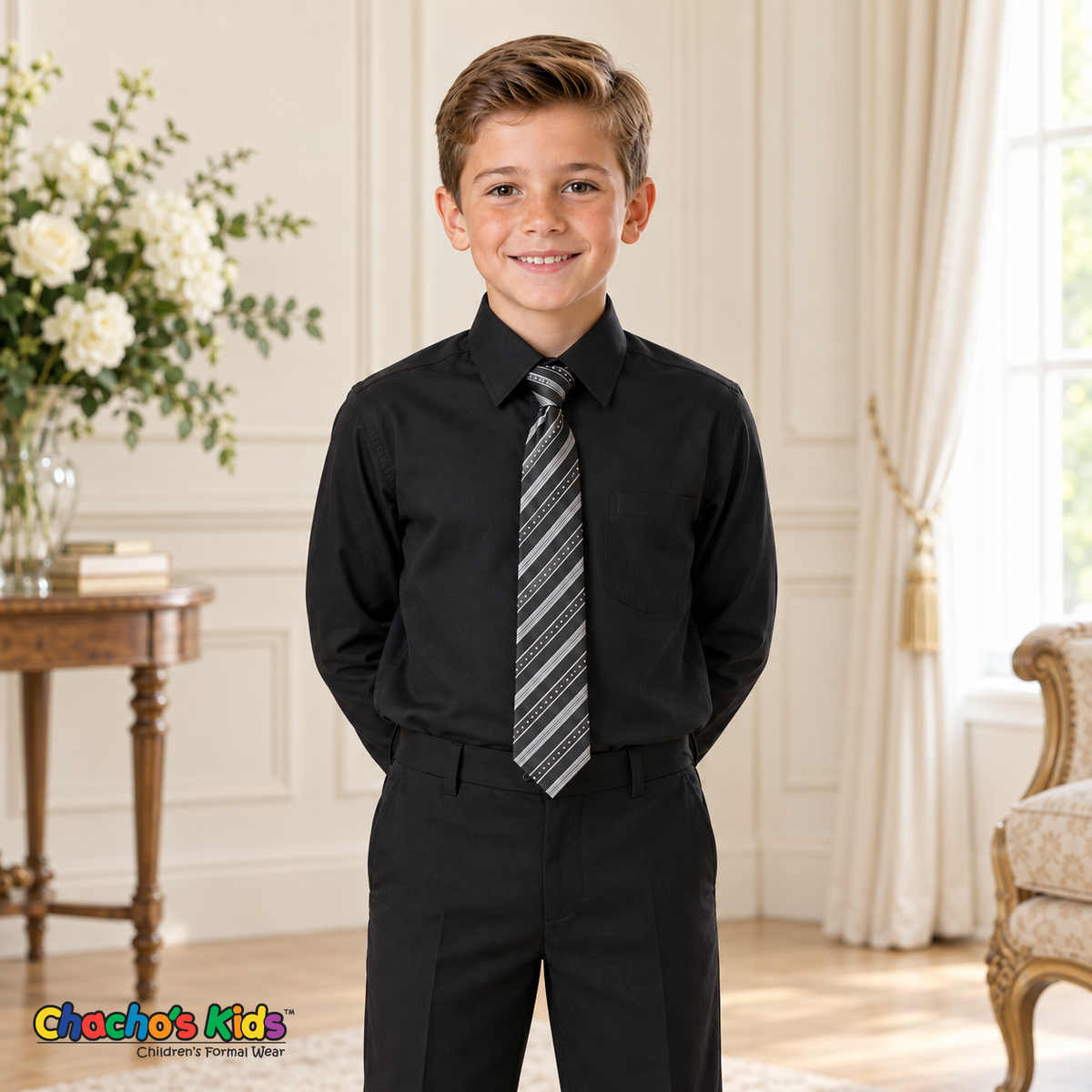 Boy wearing a classic black long-sleeve dress shirt with striped tie, tucked into black dress pants