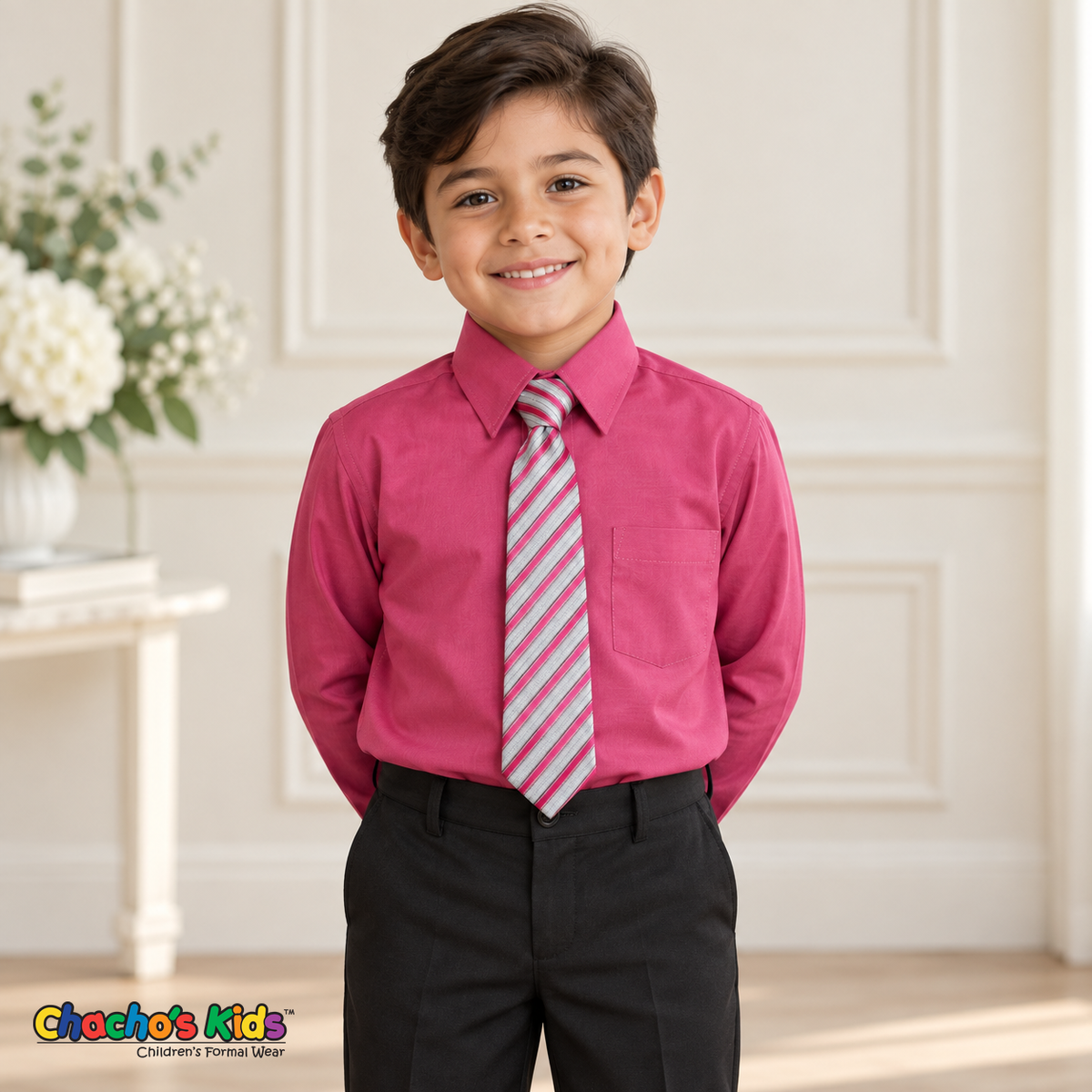 Boy wearing a classic fuchsia long-sleeve dress shirt with its coordinating patterned tie and black dress pants