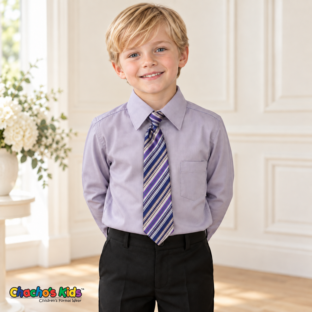 Boy wearing a classic lilac long-sleeve dress shirt with its included purple, navy and silver striped tie, tucked into black dress pants
