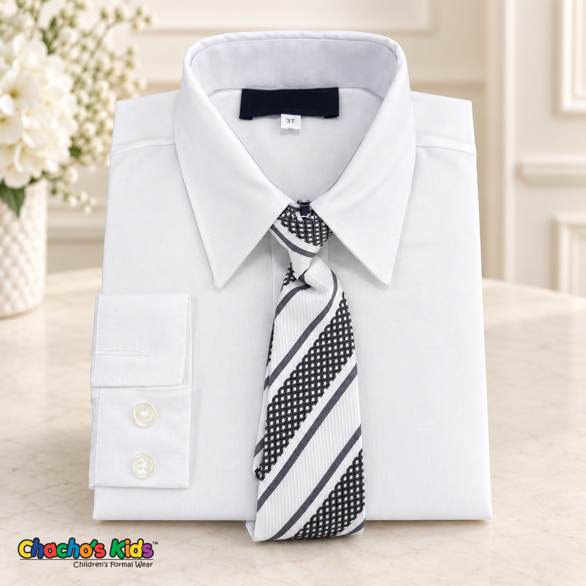 Classic white dress shirt neatly folded with its coordinating patterned tie