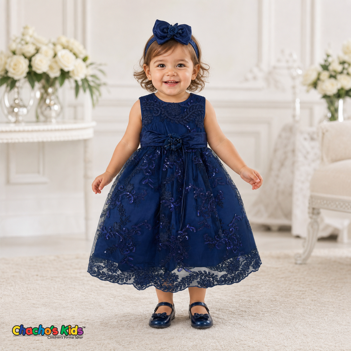 Baby girl wearing navy blue embroidered lace and tulle dress style D-1560 | Chacho's Kids