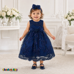 Baby girl wearing navy blue embroidered lace and tulle dress style D-1560 | Chacho's Kids