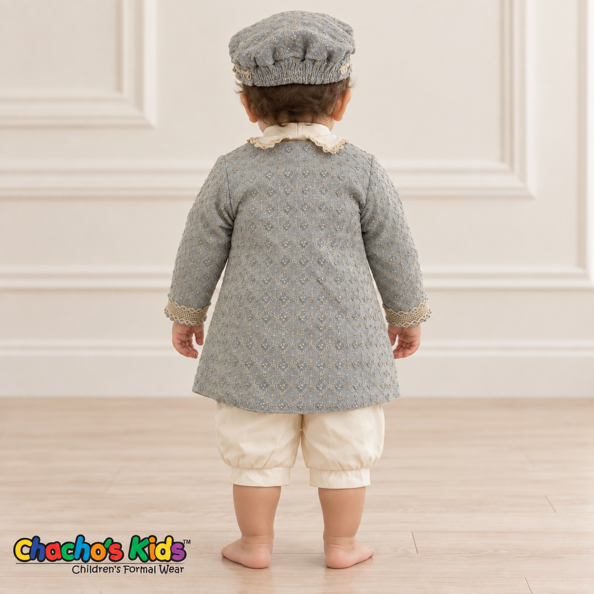 Dorian-Prince Baptism Outfit in ivory and muted blue with gold-tone trim, baby model back view with coat.