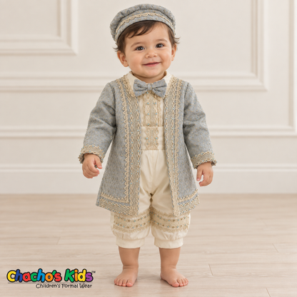 Dorian-Prince Baptism Outfit in ivory and muted blue with gold-tone trim, baby model front view with coat and matching cap.