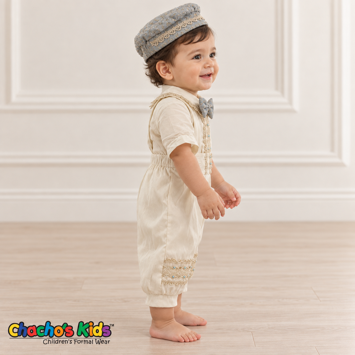 Dorian-Prince Baptism Outfit in ivory and muted blue with gold-tone trim, baby model side view without coat.