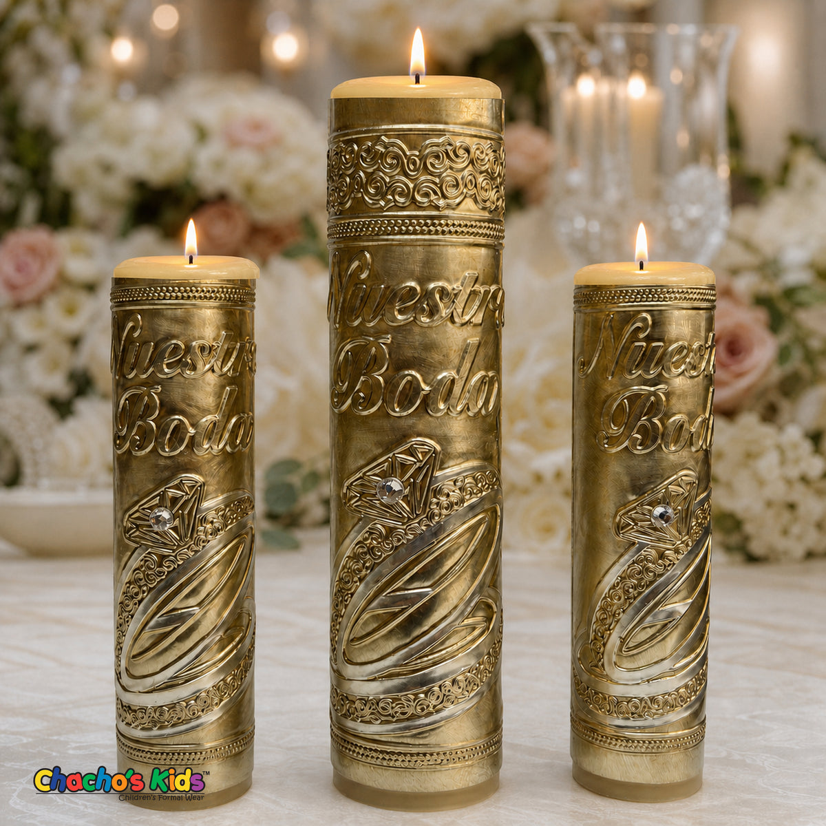 Three-piece gold embossed metal Nuestra Boda wedding unity candle set with lit ivory candles