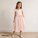 Girl wearing blush satin flower girl dress with bow, flutter sleeves and full skirt