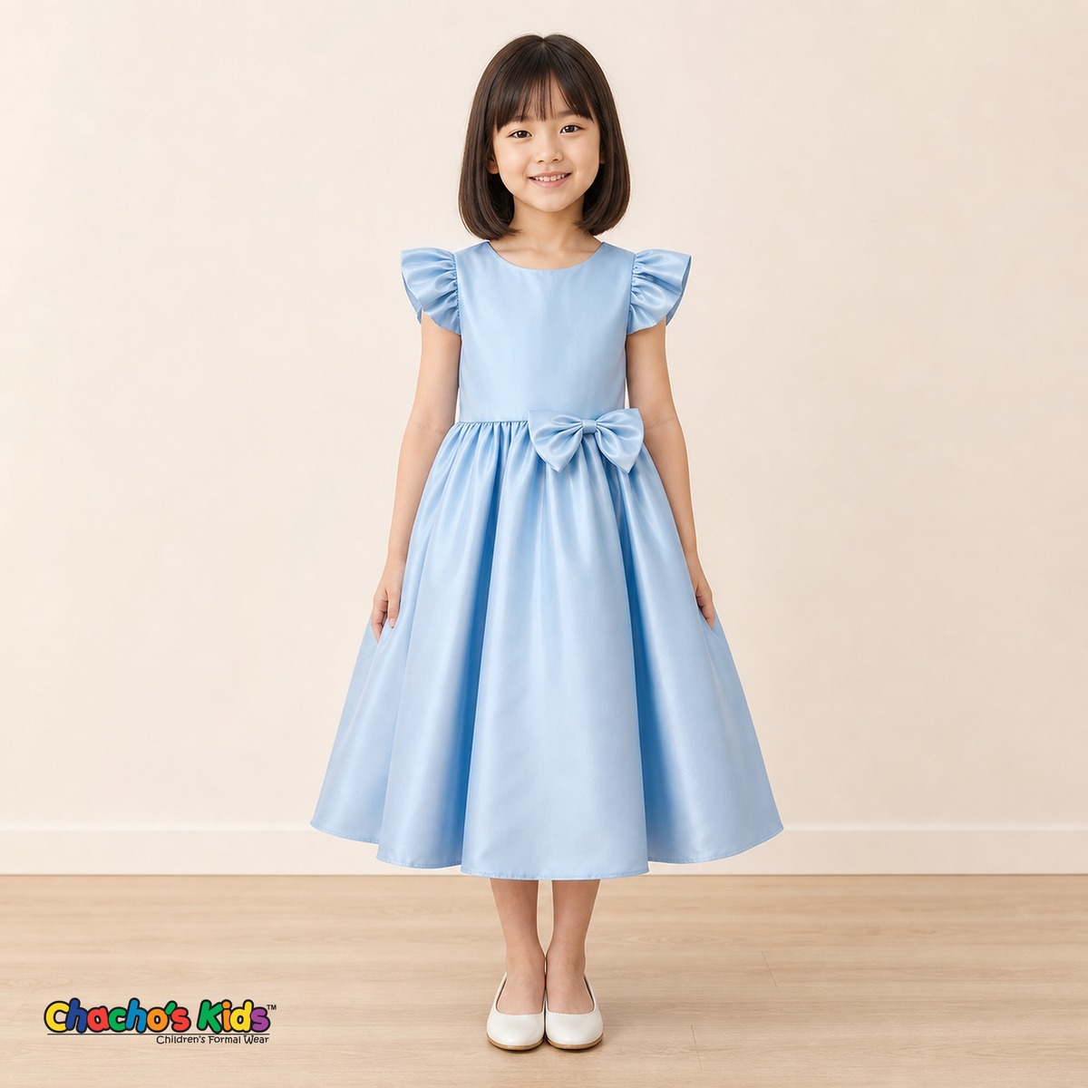 Girl wearing light blue satin flower girl dress with bow, flutter sleeves and full skirt