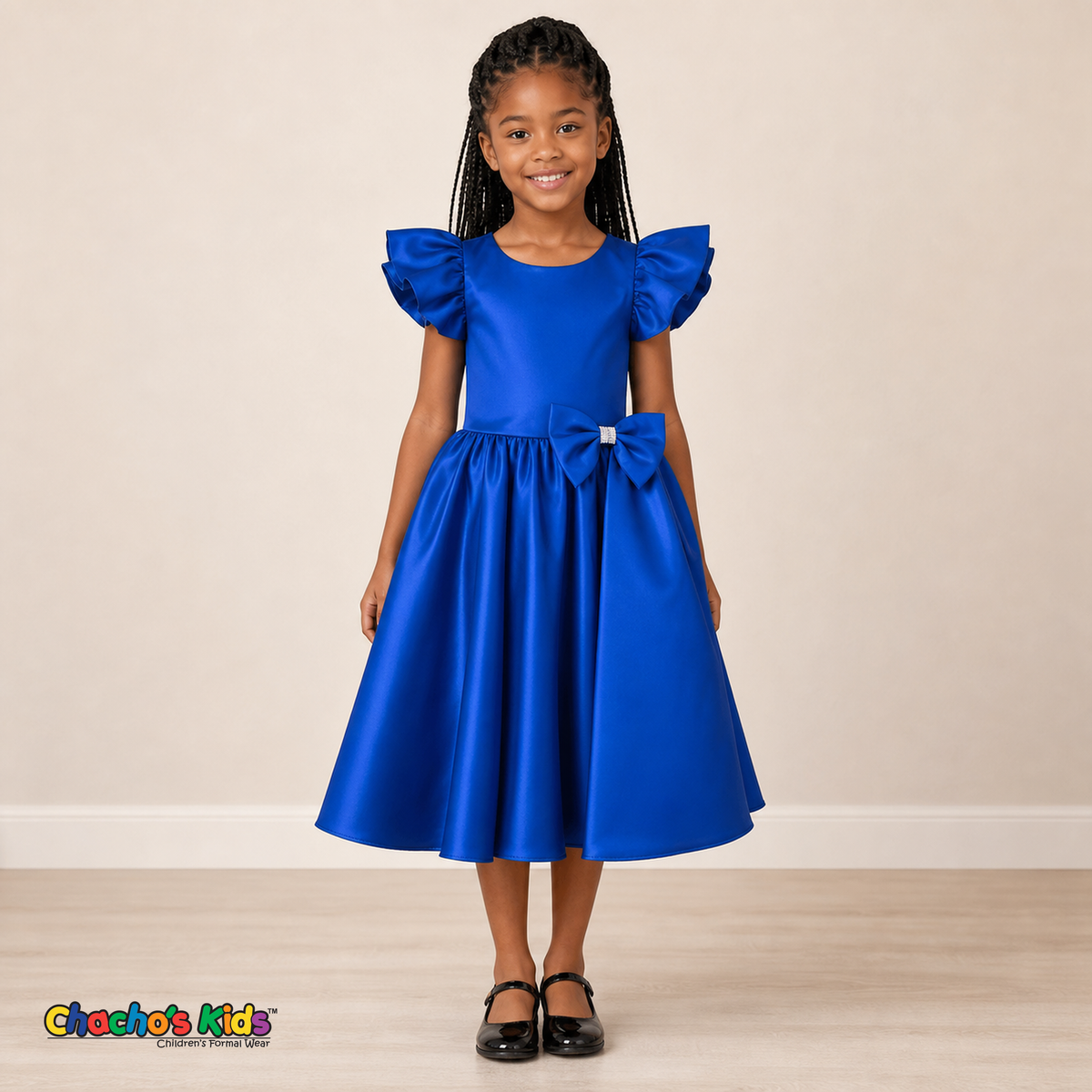 Girl wearing royal blue satin flower girl dress with bow, flutter sleeves and full skirt