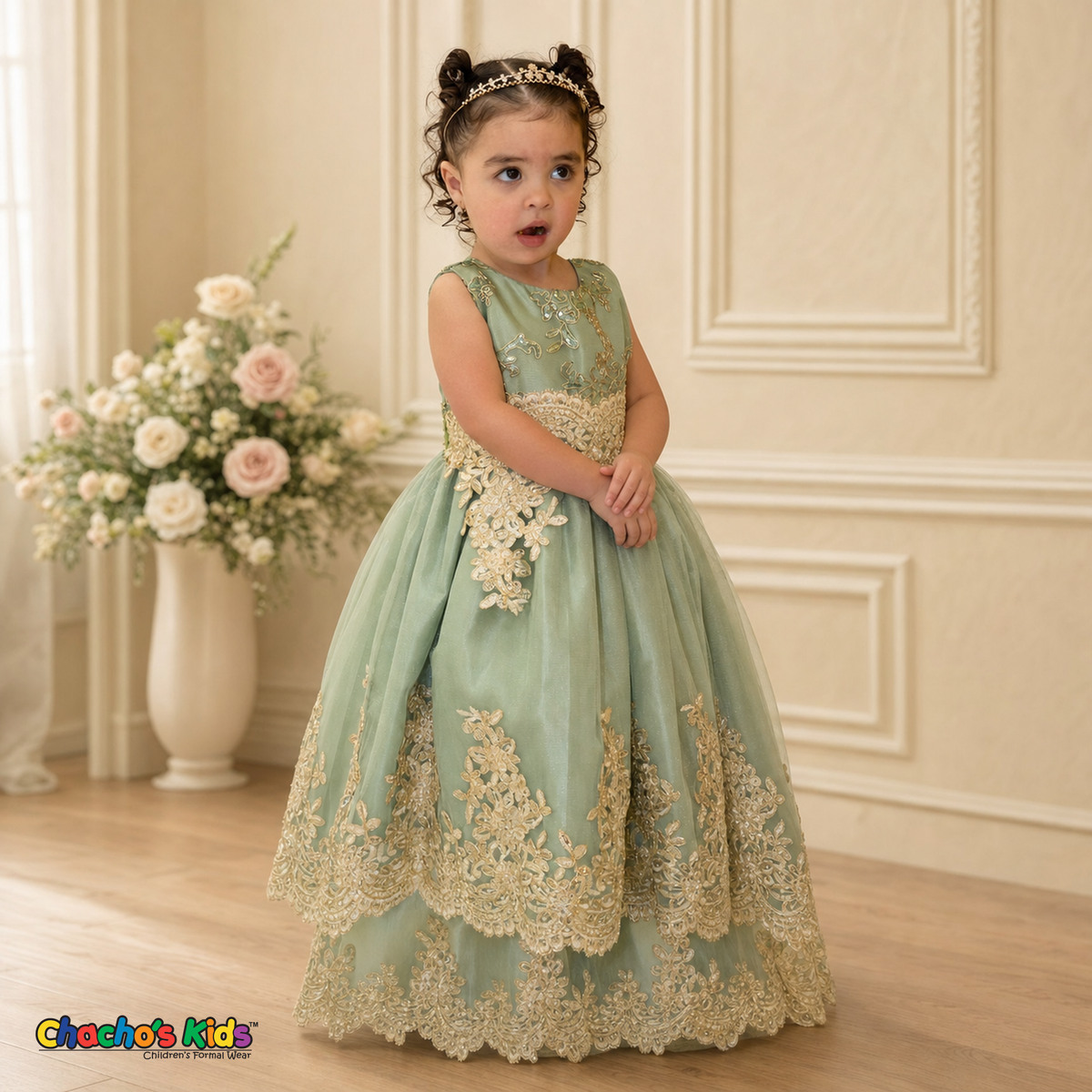 Young girl wearing Sophie sage green gold lace tulle dress with jeweled tiara