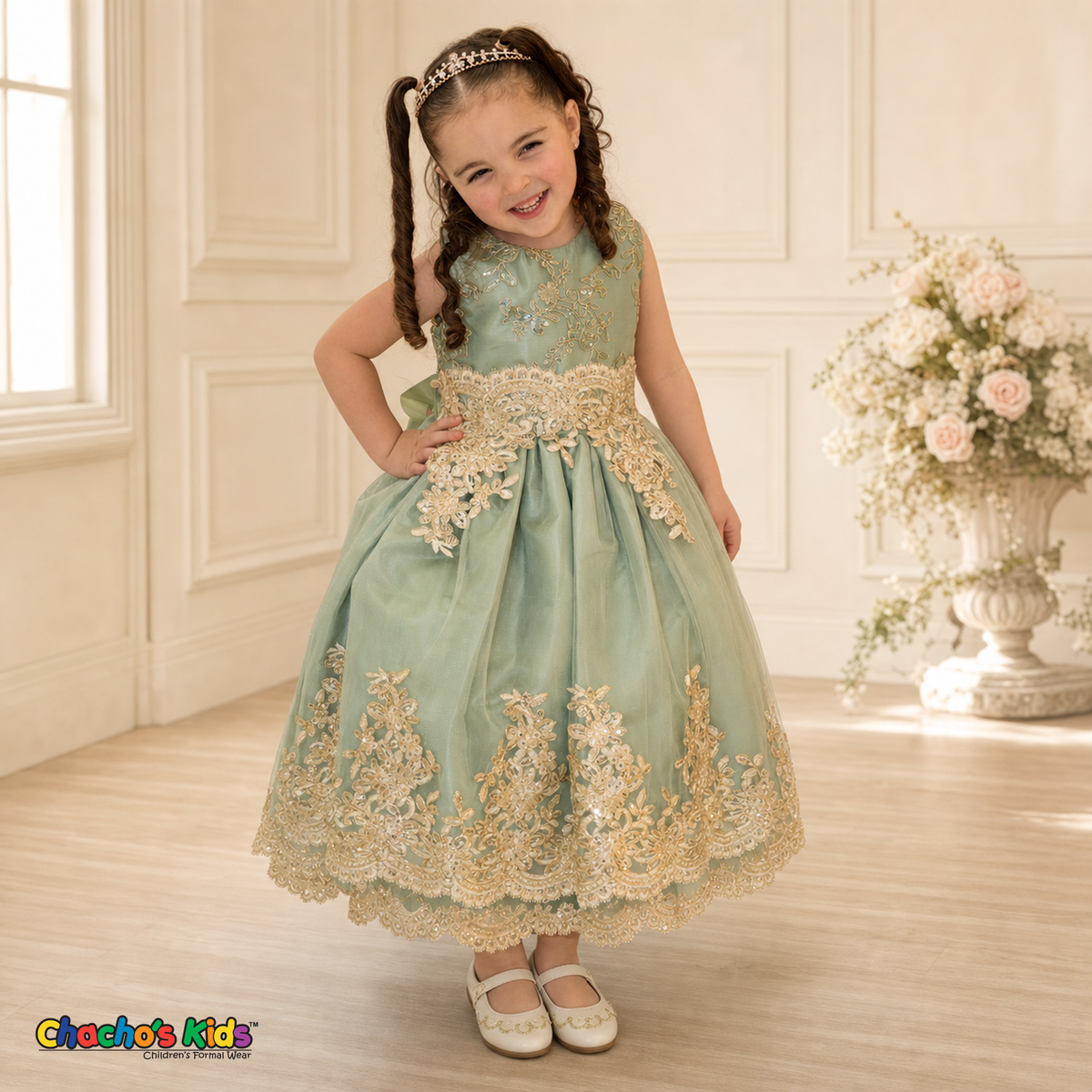 Girl modeling Sophie sage green gold lace tulle party dress in an elegant setting