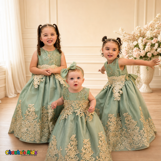 Three girls wearing Sophie sage green gold lace tulle dresses in an elegant formal setting